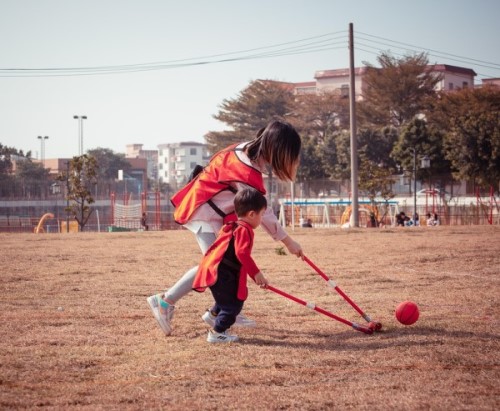 Child Parent playing in the field